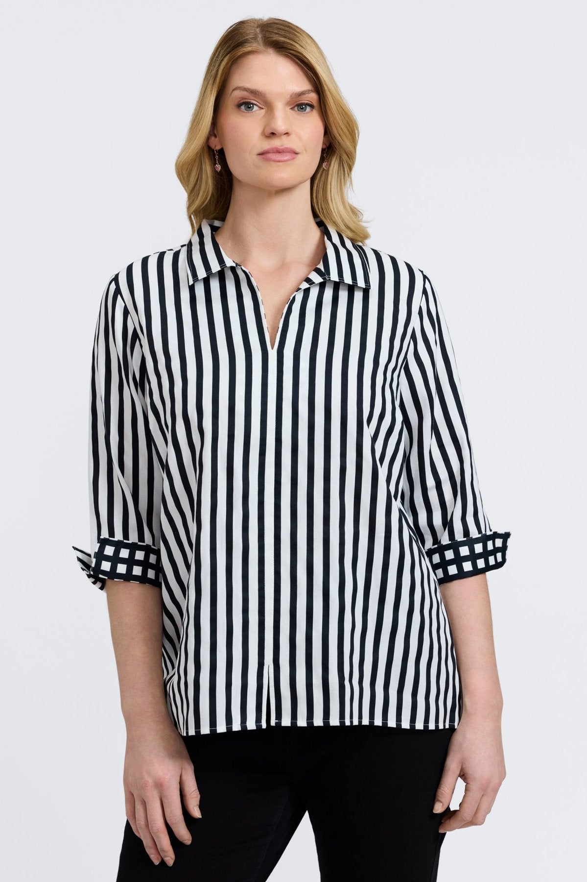 Agnes shirt with black stripes and gingham border, styled on a plus-size model for modern structure and classic charm.