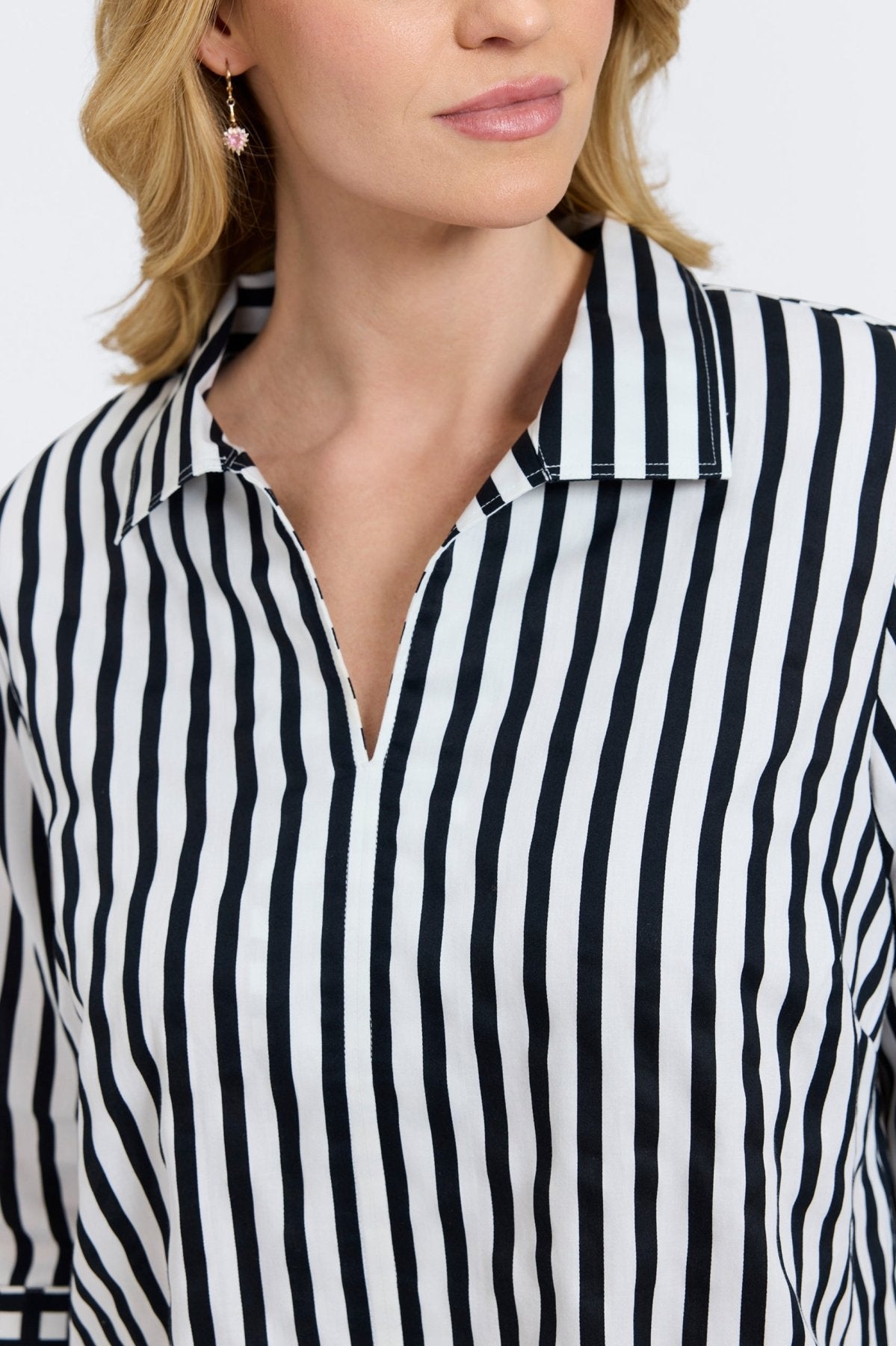 Agnes shirt with black stripes and gingham border, styled on a plus-size model for modern structure and classic charm.