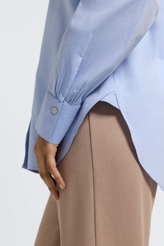 Side view of the Meghan No Iron Pinpoint Long Sleeve Shirt showing off the buttoned cuff and the half-tuck style of the shirt #color_blue wave