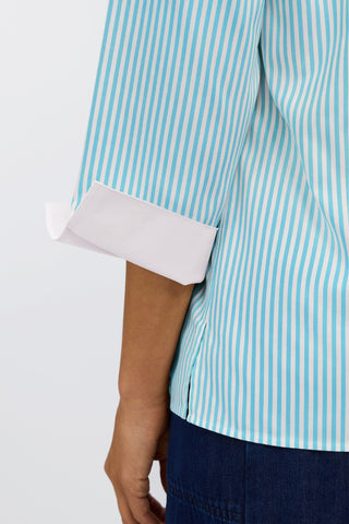Close up view of the crisp white arm cuff folded back #color_capri pinpoint stripe