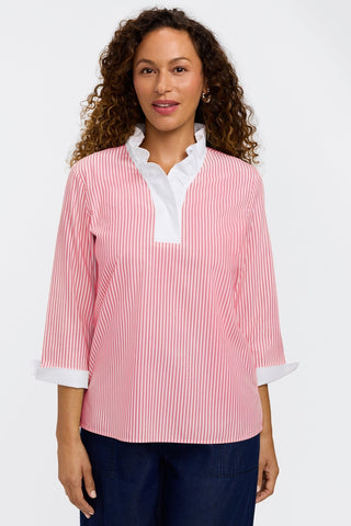 Model wearing the 3/4 sleeve popover shirt with a pair of jeans #color_coral reef pinpoint stripe