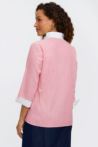 Angled back view of model wearing the pinpoint striped popover #color_coral reef pinpoint stripe