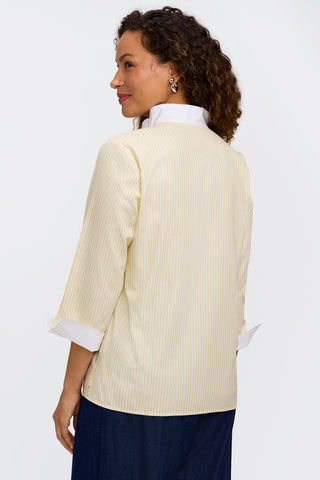 Angled back view of model wearing pinpoint striped popover #color_lemon pinpoint stripe