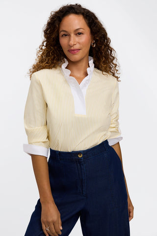 Model wearing the pinpoint striped popover shirt tucked into a pair of jeans and sleeves pushed back behind elbows #color_lemon pinpoint stripe