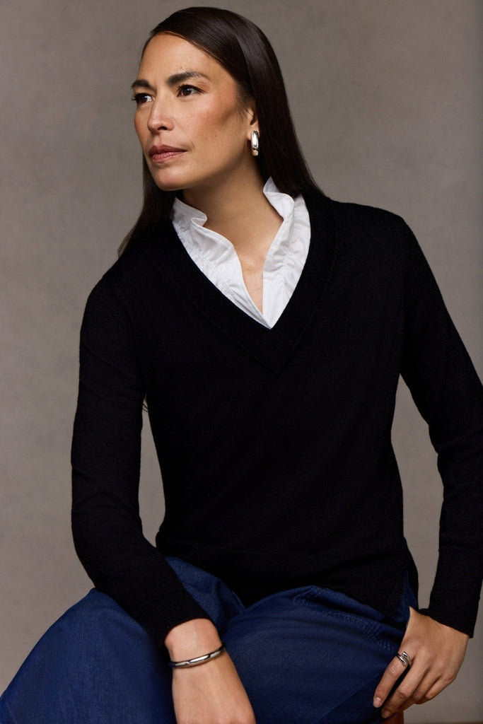 Black v-neck sweater over Tammy Knit-Woven Ruffle Collar Sleeveless Layering Tank #color_white