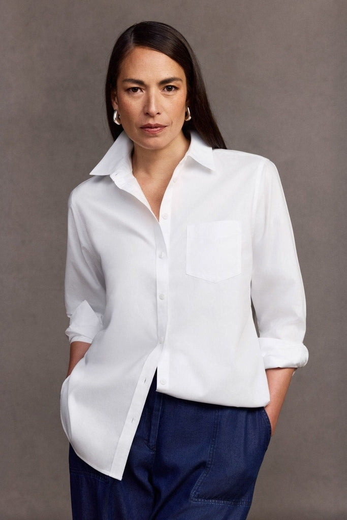 Woman wearing the Foxcroft Boyfriend tunic half tucked in #color_white