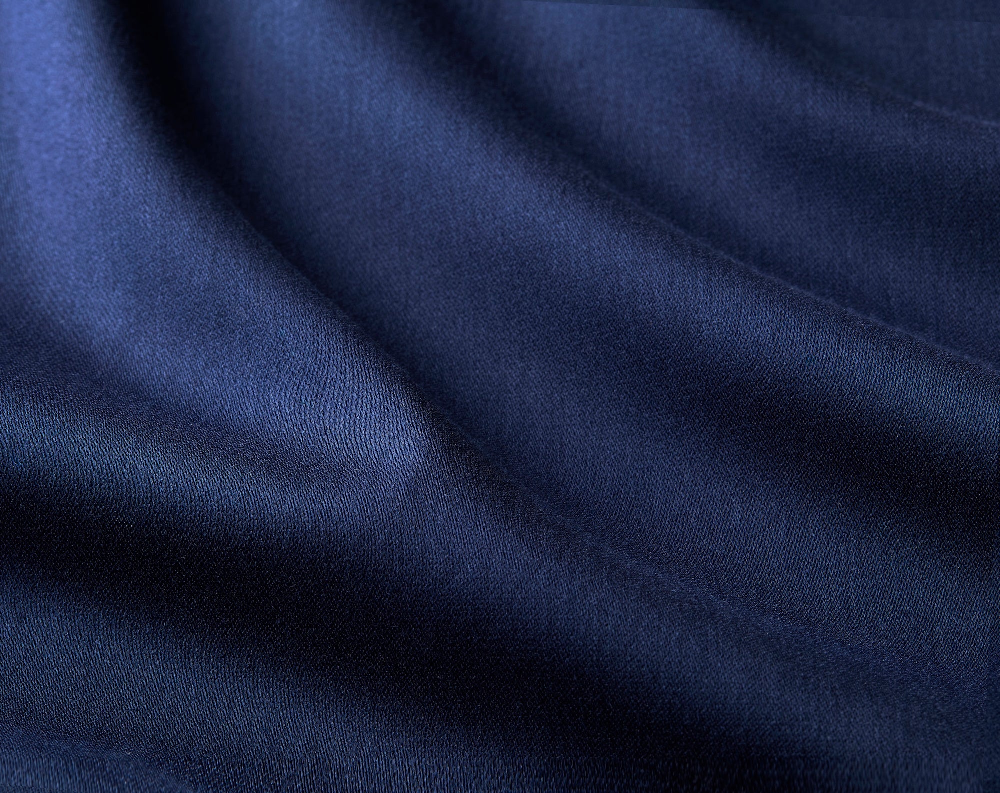 Matte sateen fabric close-up highlighting Foxcroft’s smooth stretch finish